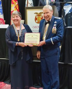 CAPT Carrie Nielson accepts the 2025 General Pershing Chapter of the Year Award